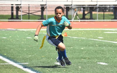 10 year old mixed race boy running in flag football game, summer
Downers Grove, Illinois  USA